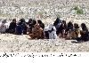 women are sitting out side from the Chiltan Express